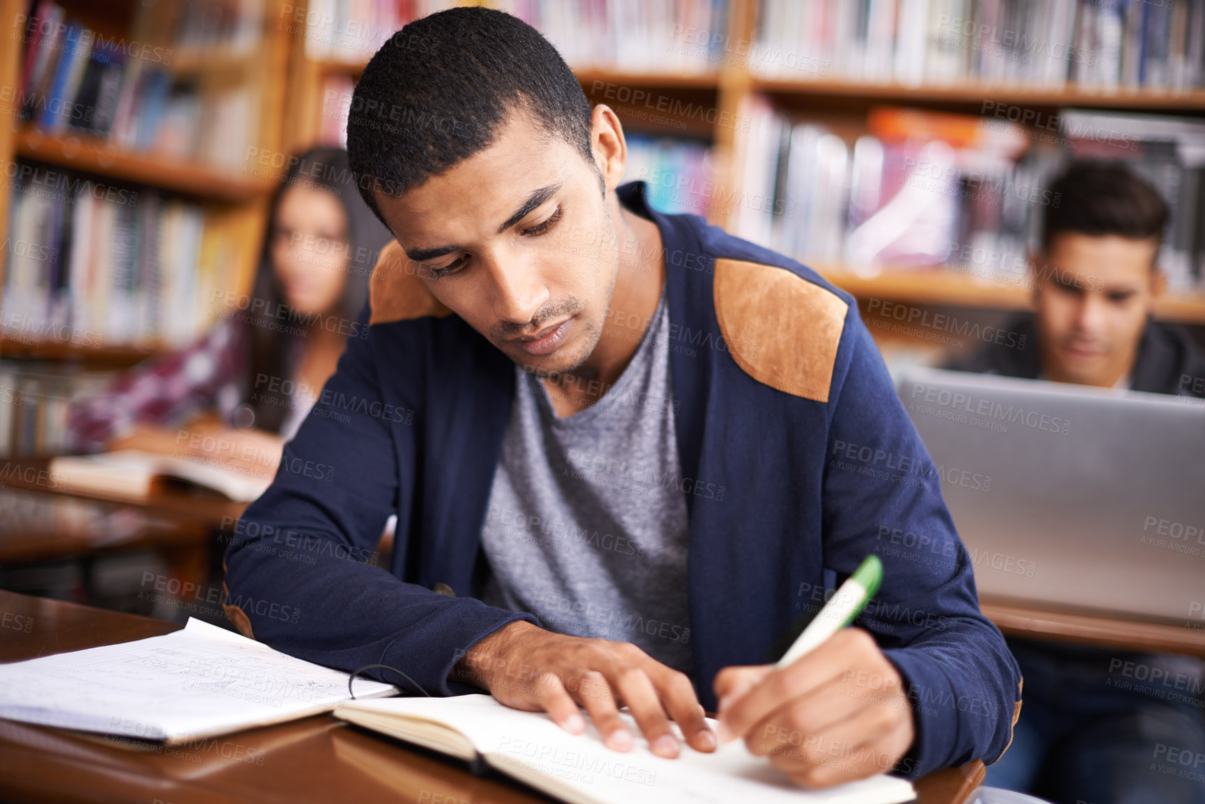 Buy stock photo Study, writing and college with man in library for education, research and classroom quiz. Focus, learning and notebook with male student on university campus for knowledge, scholarship and project