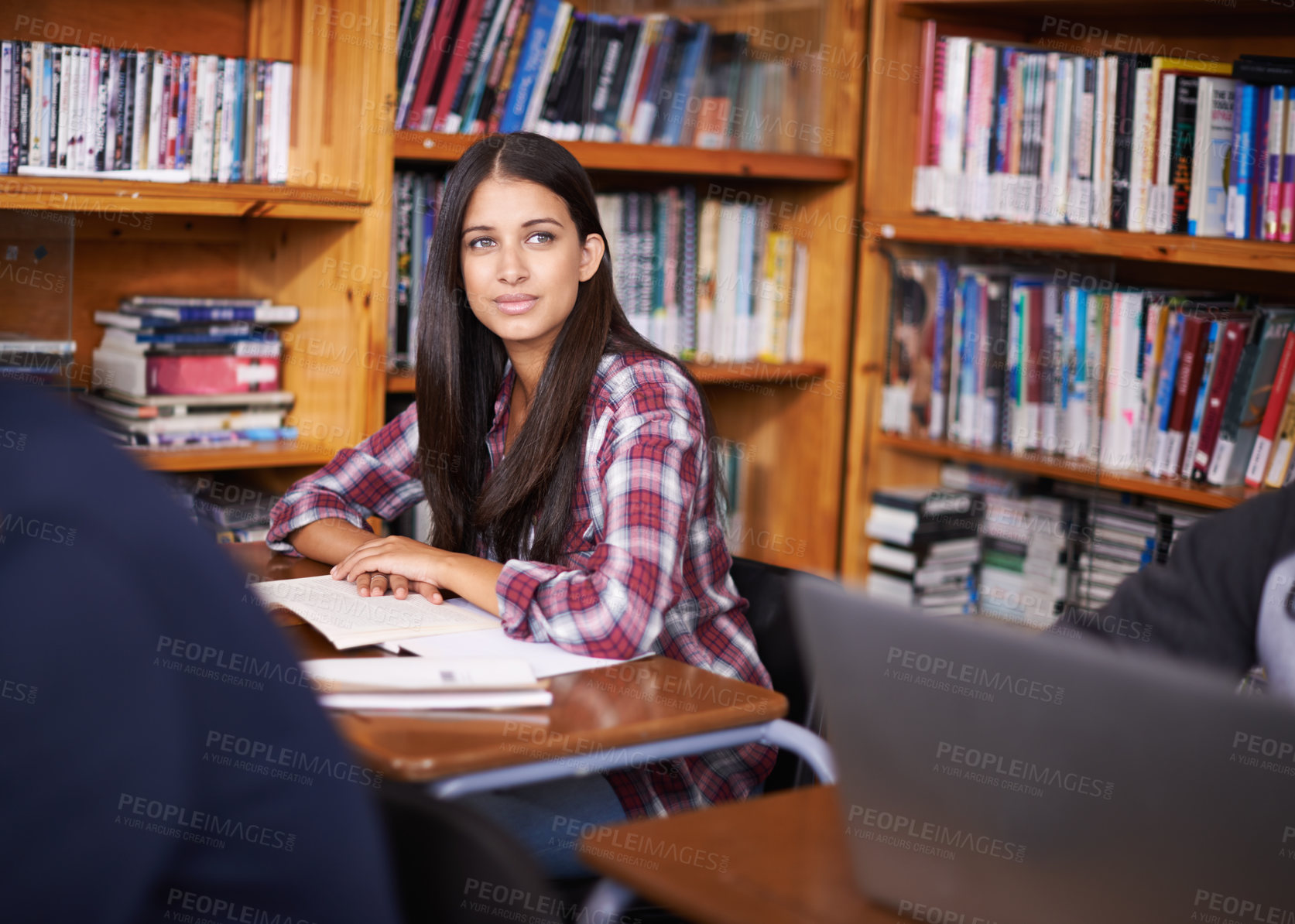 Buy stock photo University student, thinking or studying in library for exam or education on campus for class assignment. Young, woman and happy for scholarship for learning and books for test preparation by desk