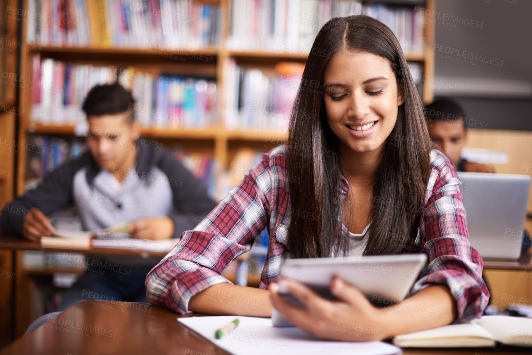 Buy stock photo University, tablet and woman in library happy for online research, studying and learning. Education, academy and female student on digital technology for knowledge, internet and website course