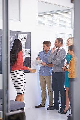 Buy stock photo Creative coach, chalkboard and presentation with team for storyboard, development or meeting at office. Speaker talking to group of employees for project planning, production or startup at workplace