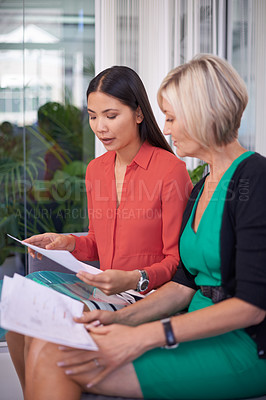 Buy stock photo A cropped shot of two attractive businesswoman having a meeting in an office