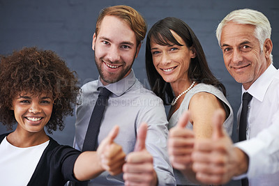 Buy stock photo Business people, teamwork and thumbs up in studio portrait for success, winning and achievement or thank you emoji. Professional group with mature boss for like, yes and feedback on a wall background