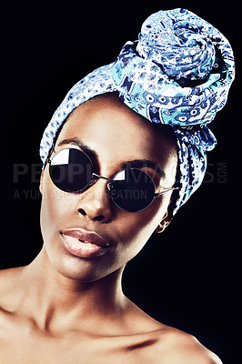 Buy stock photo Portrait, turban and culture with African woman in studio isolated on black background for heritage. Aesthetic, face and shades with confident young model in trendy headwear for traditional style