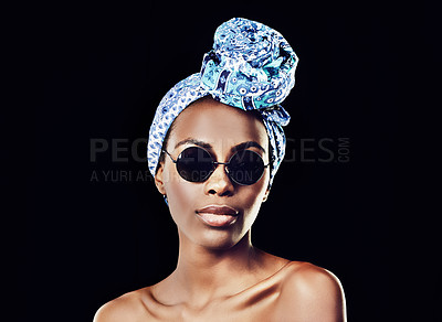 Buy stock photo Portrait, fashion and tradition with African woman in studio isolated on black background for heritage. Aesthetic, face and sunglasses with confident young model in trendy headwear for style culture