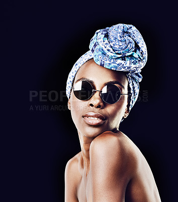 Buy stock photo Portrait, beauty and fashion with African woman in studio isolated on black background for heritage. Culture, model and sunglasses with confident young person in trendy headwear for traditional style