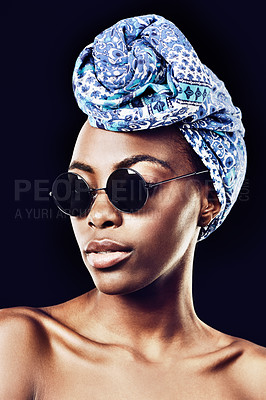 Buy stock photo Face, fashion and culture with African model in studio isolated on black background for heritage. Aesthetic, woman and sunglasses with confident young person in trendy headwear for traditional style