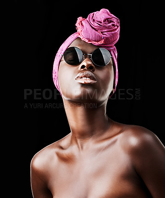 Buy stock photo Face, fashion and culture with black woman in studio isolated on dark background for heritage. African, model and sunglasses with confident young person in trendy headwear for traditional style