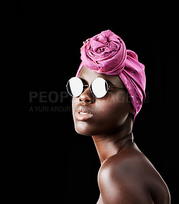 Buy stock photo Face, fashion and shades with African woman in studio isolated on black background for heritage. Beauty, model and sunglasses with confident young person in trendy headwear for traditional style