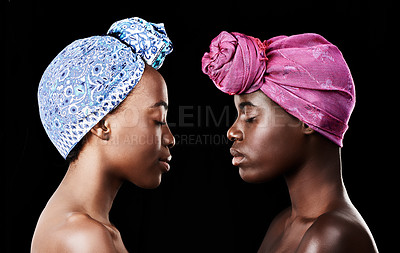 Buy stock photo Studio, sisters and black women with skincare for beauty, profile and head wrap for aesthetic. Dark background, African female people and glow with shine of face, cosmetics and dermatology results