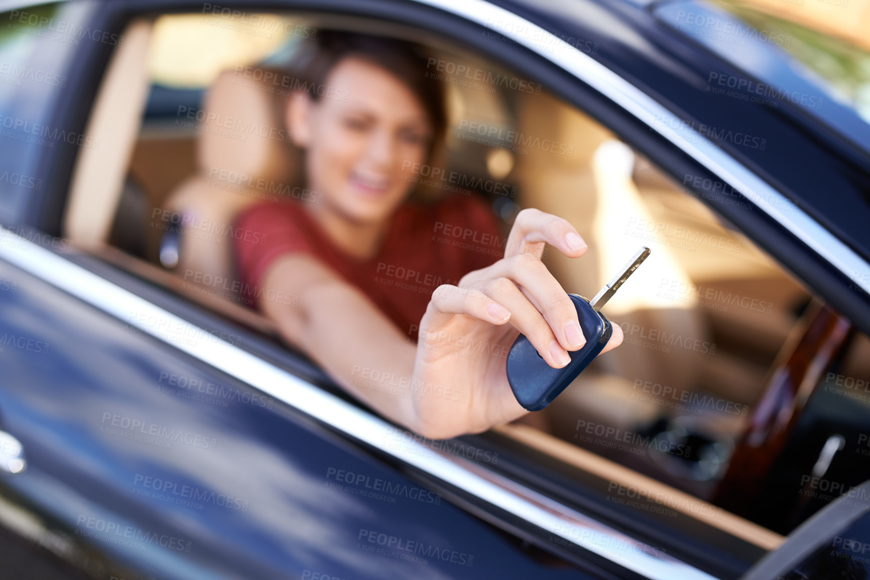 Buy stock photo Closeup shot of a woman sitting in a car holding the keys up to the camera