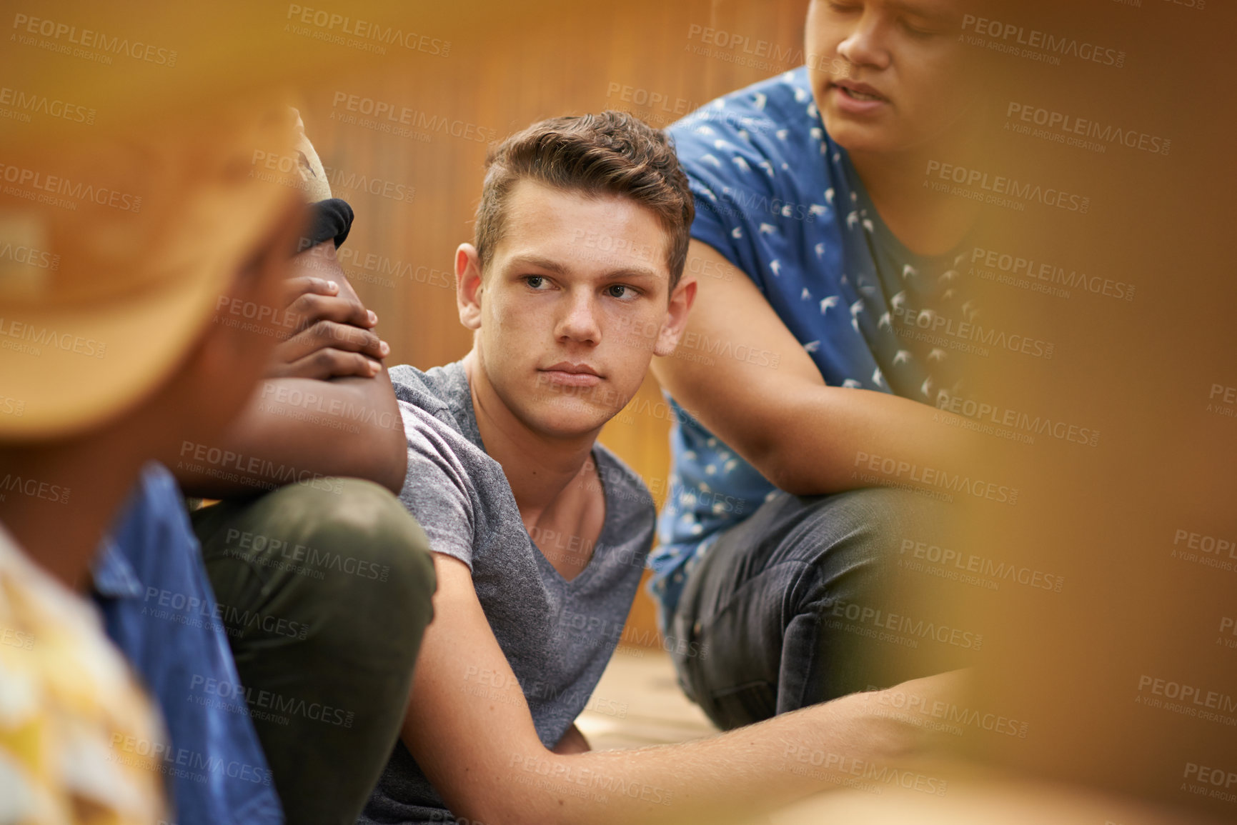 Buy stock photo Summer, friends and fun with group, guy and conversation with discussion and bonding together. People, men and teenagers with nature and relaxing with youth development camp and support in a park
