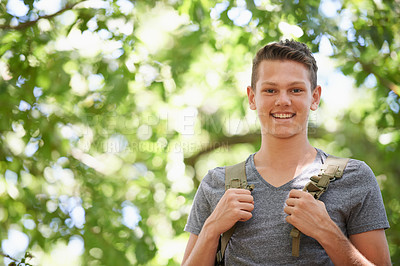 Buy stock photo Teenager, portrait and smile in tree nature with backpack or explore trekking in woods or adventure, travel or summer. Male person, face and forest holiday in Australia or hike, vacation or break