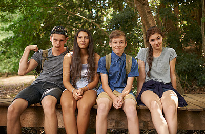 Buy stock photo Teen, friends and happy in forest for hike on outdoor to relax with camping and break in California. Woods, diverse group and people together in summer for holiday with bonding, fun and adventure.