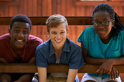 Buy stock photo Friends, summer camp and portrait of teenagers on holiday, adventure or vacation by outdoor cabin. Freedom, travel and group of young people on weekend trip together for bonding sitting by house.