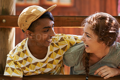 Buy stock photo Friends, summer camp and couple of teenagers on holiday, adventure or vacation by outdoor cabin. Freedom, travel and young people on weekend trip together for bonding sitting by wooden house.