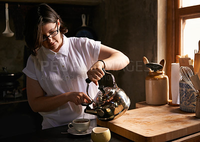 Buy stock photo Prepare, tea and woman in kitchen with drink in morning for calm break or routine process in home. Healthy, matcha or person with kettle for breakfast beverage to start holiday or vacation and relax