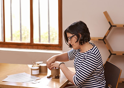 Buy stock photo A cropped shot of a busy woman working in a home office
