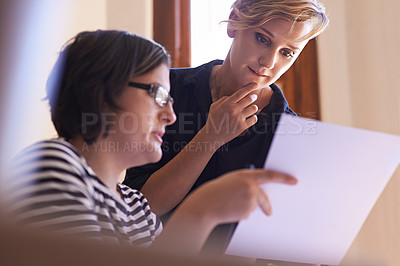 Buy stock photo A cropped shot of two women working together in a home office