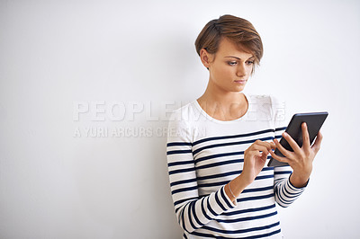 Buy stock photo Woman, studio and touch with tablet, browsing and face for social media or communication. Girl, mockup and browse with technology, online connection or internet message isolated on white background