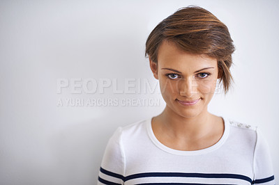 Buy stock photo A cropped portrait of a beautiful young girl standing against a white
