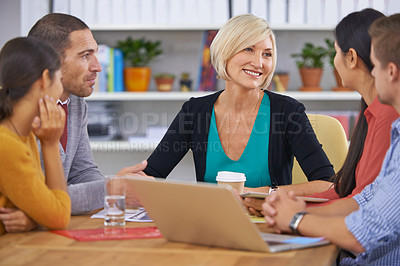 Buy stock photo Senior woman, leadership and business meeting in office for planning, collaboration and workshop in startup company. Happy manager, laptop and diverse group of people for discussion, idea or teamwork