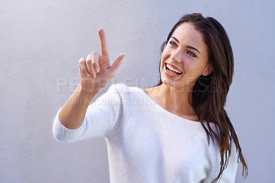 Buy stock photo Fashion, pointing and woman with smile for sweater with warm, texture and casual for winter. Studio background, female person with happiness, joy and girl with jersey of wool for comfort in New York