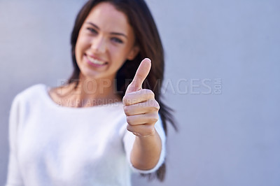 Buy stock photo Thumbs up, happy and portrait of woman with success, winner and goal reached isolated on gray background. Hand, female person and gesture for yes, thank you and achievement with smile in studio