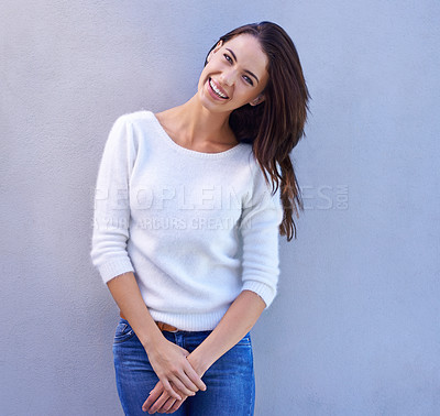 Buy stock photo Portrait of a happy young woman standing against a grey background