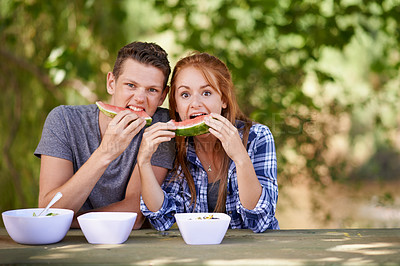 Buy stock photo Portrait, picnic and watermelon with couple, eating and fun with happiness and summer with nature. Face, people and man with woman or hungry with sunshine or sharing fruit with fresh air or nutrition