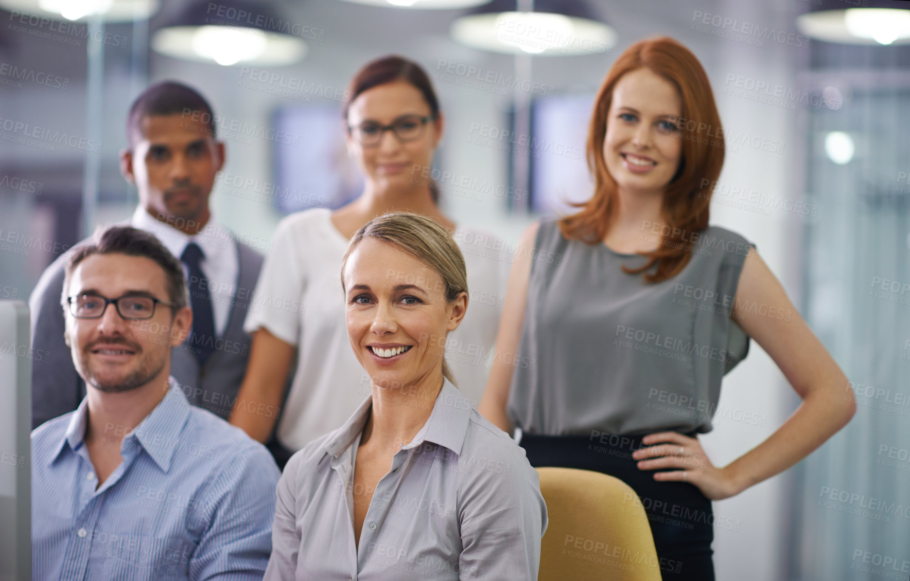 Buy stock photo Group portrait of smiling businesspeople with computer working together on project, innovating design or collaborating on company vision. Smiling, happy and proud team of diverse office men and women