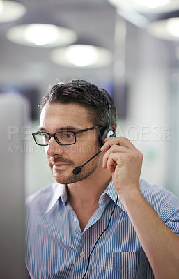 Buy stock photo Cropped shot of a businessman wearing a headset