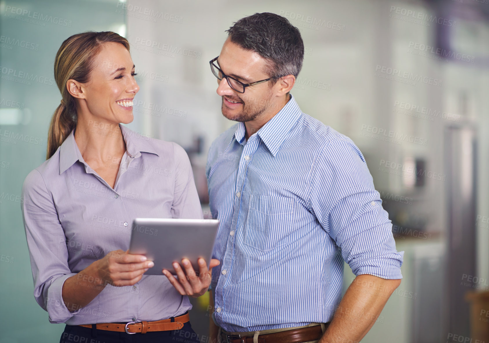 Buy stock photo Happy, business people and team with tablet for research, communication or networking at the office. Businessman and woman with smile on technology for online search, browsing or app at the workplace