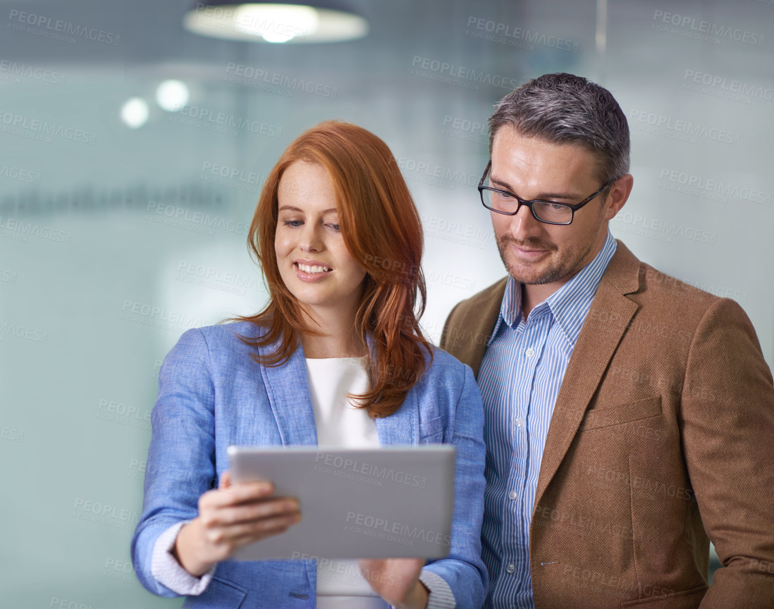 Buy stock photo Planning, innovation and talking about ideas on a tablet while creative businesspeople check their growth on a mobile app. Teamwork, collaboration and thinking while sharing vision and mission online