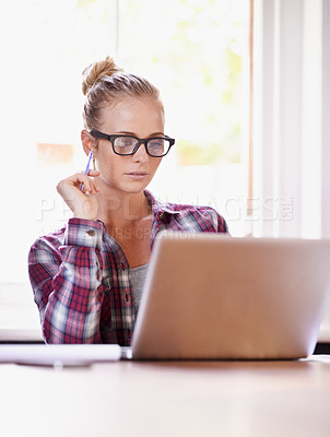 Buy stock photo Reading, designer and woman with remote work, laptop or glasses in home office for creative ideas. Website, documents review or freelancer in a startup, business or house with online report or news