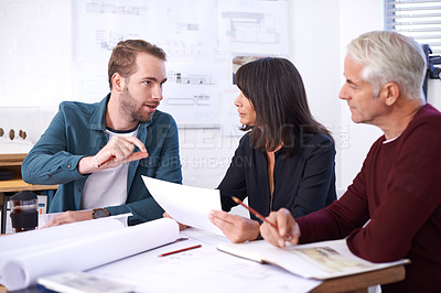 Buy stock photo Architecture, planning and teamwork in meeting with paperwork, discussion and blueprint for building project. Civil engineering, development and business people, men and woman in office brainstorming