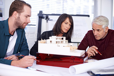 Buy stock photo Team, architect and meeting with model for building, house and planning together at workspace. Engineer, group and partnership working on collaboration, thinking or 3d of design for construction