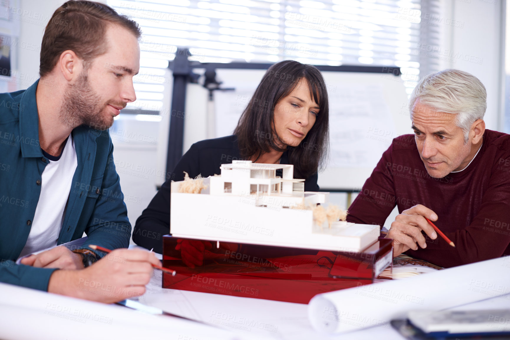 Buy stock photo Team, architect and meeting with model for building, house and planning together at workspace. Engineer, group and partnership working on collaboration, thinking or 3d of design for construction