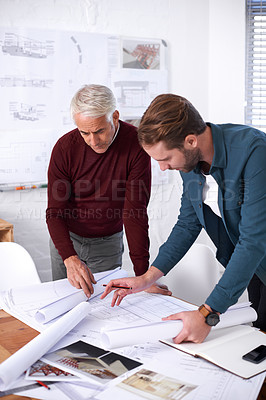 Buy stock photo Cropped shot of two male architects working together in their office