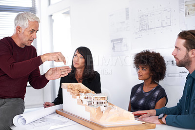 Buy stock photo Architecture, business people and building model with teamwork, brainstorming and planning for a project. Cooperation, group and engineering with creativity and blueprint with construction or meeting