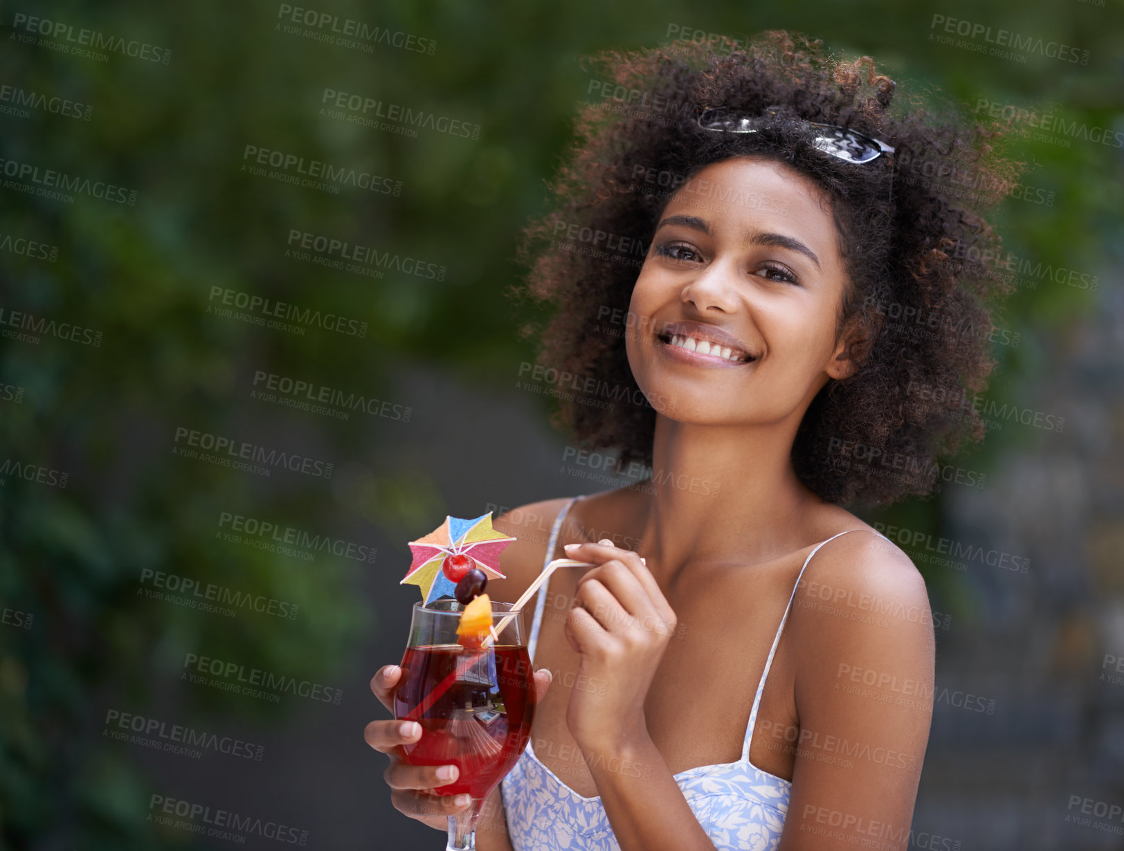 Buy stock photo African, woman and portrait with cocktail and summer or vacation, relax or happy for wellness at resort. Holiday, tropical retreat or natural black female person, fruit liquid for drinking in nature 