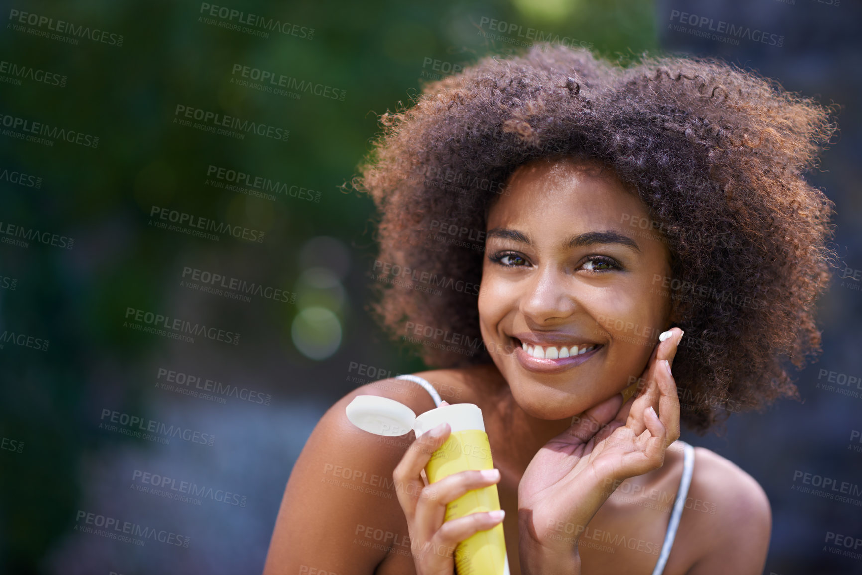 Buy stock photo African, woman and sunscreen and hand in nature, body care or lotion for heat or sun protection with natural female person. Smiling, excited girl with product tube or summer fun on holiday retreat