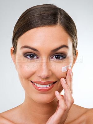 Buy stock photo Woman, portrait and cream for skincare with beauty, dermatology with cosmetics product or moisturizer in studio. Face, sunscreen or lotion for skin glow and antiaging facial on white background