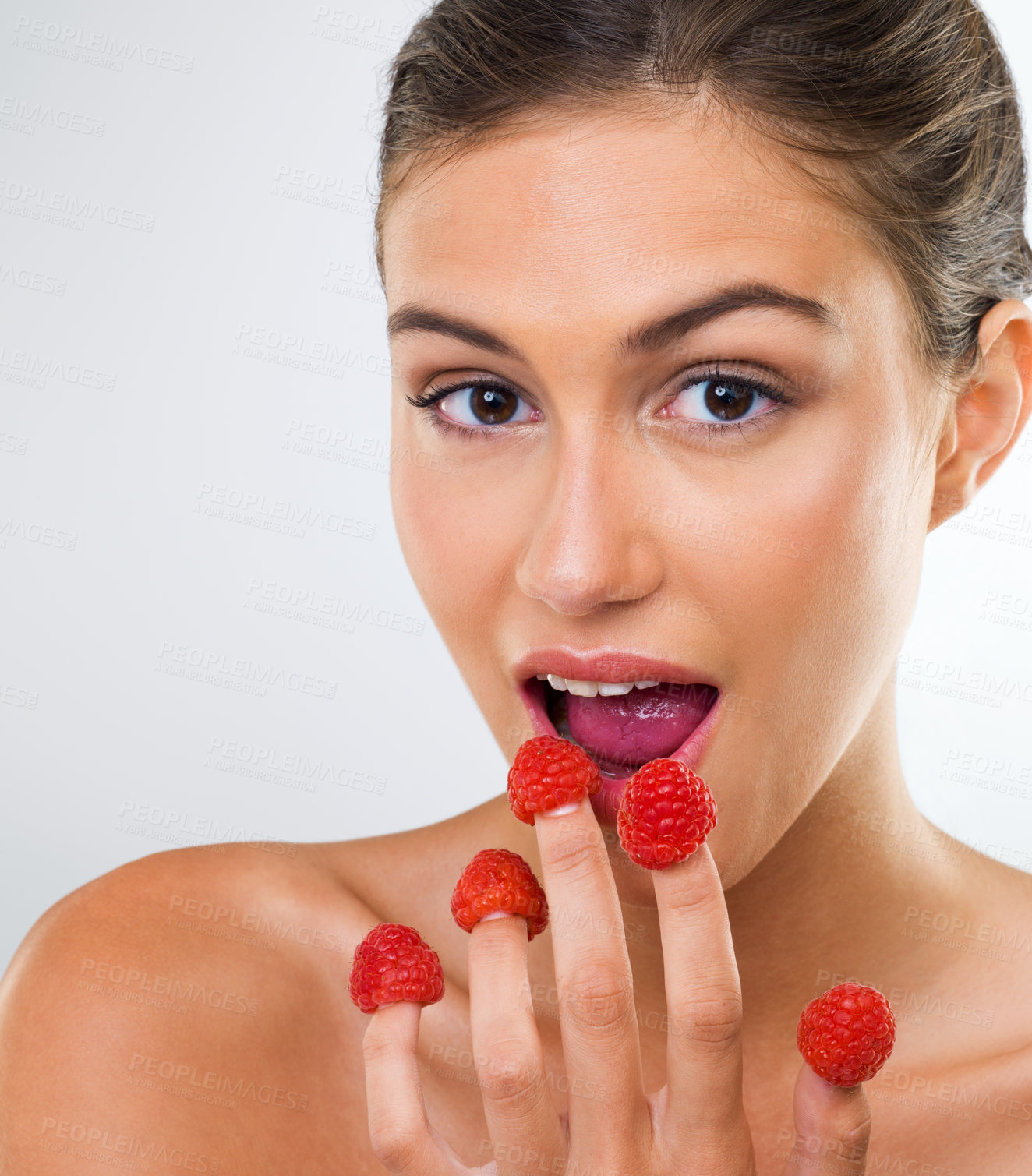 Buy stock photo Woman, portrait and raspberry with eating in studio for wellness detox, healthy body and nutrition diet. Model, person and fruit for organic cosmetics, natural beauty and skincare on white background