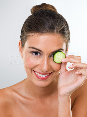Buy stock photo Woman, portrait and cucumber for health in studio with wellness detox, healthy eating and nutrition diet. Model, person and fruit for organic cosmetics, natural beauty or skincare on white background