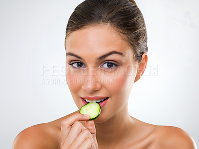 Buy stock photo Woman, portrait or cucumber for eating in studio with wellness detox, healthy vegetable or nutrition diet. Model, person or fruit for organic cosmetics, natural beauty or skincare on white background
