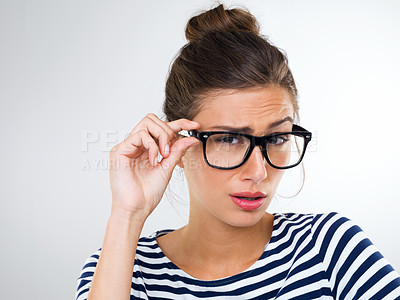 Buy stock photo Confused, woman and portrait with surprise in studio, white background and mockup of questions. Doubt, why and college student with glasses thinking of feedback or information with anxiety or stress 