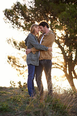 Buy stock photo Outdoor, hug and couple with love, nature and happiness with romance and bonding together in a park. People, embrace or woman with man or date with marriage or relationship with sunset or anniversary
