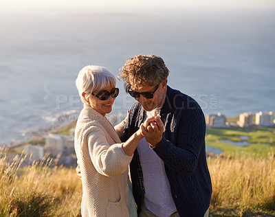 Buy stock photo Happy, holiday and couple outdoor in dance on hill or mountain in Cape Town and holding hands with love. Mature, people and embrace with kindness on vacation adventure in nature and relax together