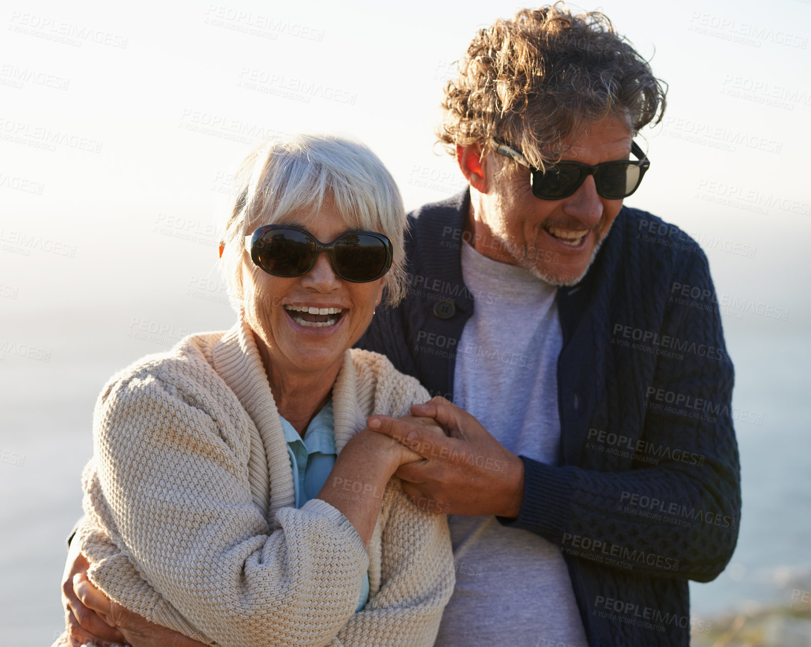 Buy stock photo Happy, nature and senior couple with love for travel, tourism and holiday in retirement together. Coast, field and elderly people with smile for summer vacation, bonding and sunset walk in California