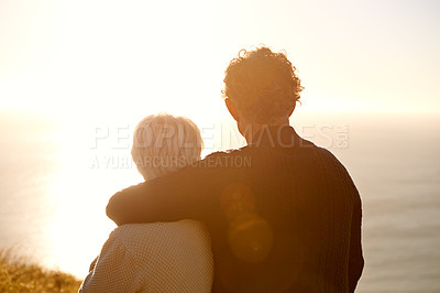 Buy stock photo Cropped view of a senior couple standing on a hillside together